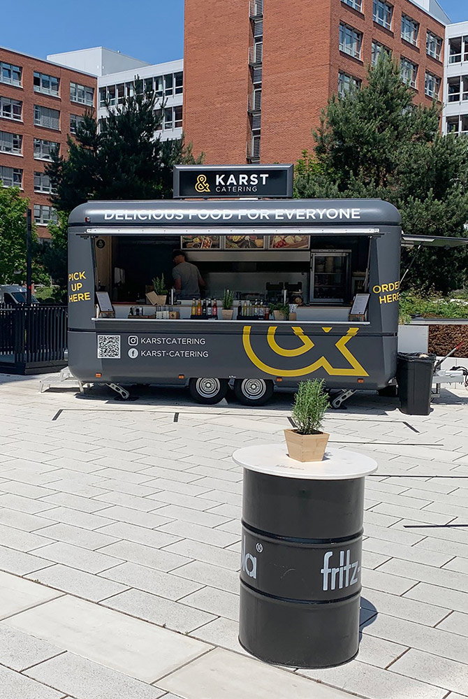 Grey food truck with rounded corners.